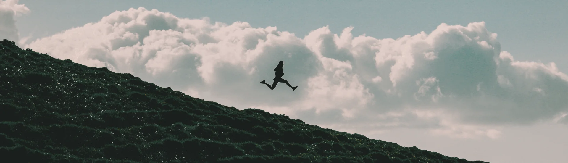 Silhouette of running person against clouds — C&C Talks course, on demand consultation