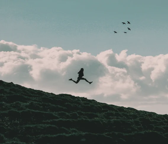 Silhouette of running person against clouds — C&C Talks course, on demand consultation