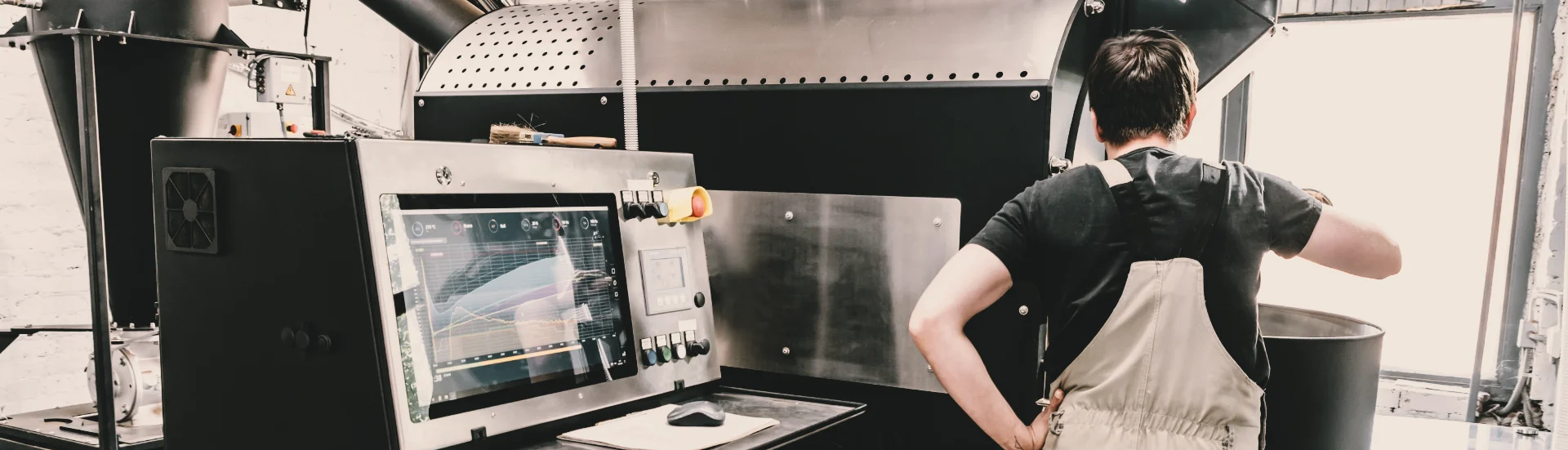 Coffee roaster at roasting machine with monitor — The Profile course, roasting and brewing